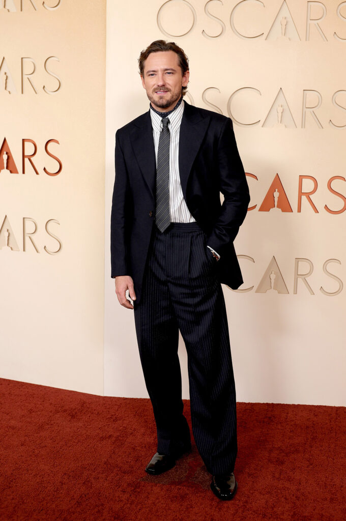 Lewis Pullman Oscars 2026, Lewis Pullman 2026 Oscars red carpet, Lewis Pullman Saint Laurent Oscars, Lewis Pullman Anthony Vaccarello Saint Laurent, Lewis Pullman Oscars menswear, Lewis Pullman Saint Laurent suit Oscars, Lewis Pullman striped shirt tie Oscars, Oscars 2026 red carpet Lewis Pullman, Saint Laurent Oscars Lewis Pullman