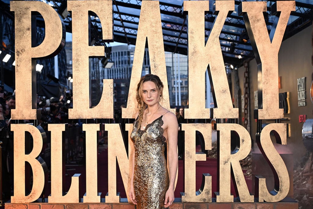 Rebecca Ferguson Roberto Cavalli, Roberto Cavalli Spring 2026, Fausto Puglisi Roberto Cavalli, Peaky Blinders The Immortal Man premiere, Birmingham world premiere, metallic gold gown, froissé lamé dress, celebrity red carpet fashion 2026