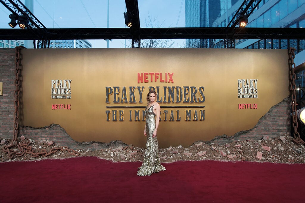 Rebecca Ferguson Roberto Cavalli, Roberto Cavalli Spring 2026, Fausto Puglisi Roberto Cavalli, Peaky Blinders The Immortal Man premiere, Birmingham world premiere, metallic gold gown, froissé lamé dress, celebrity red carpet fashion 2026