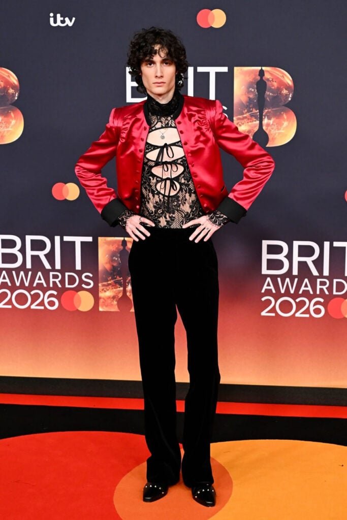 Sombr BRIT Awards 2026, Sombr custom Valentino, Sombr lace shirt red jacket, Valentino menswear 2026, Sombr red carpet look