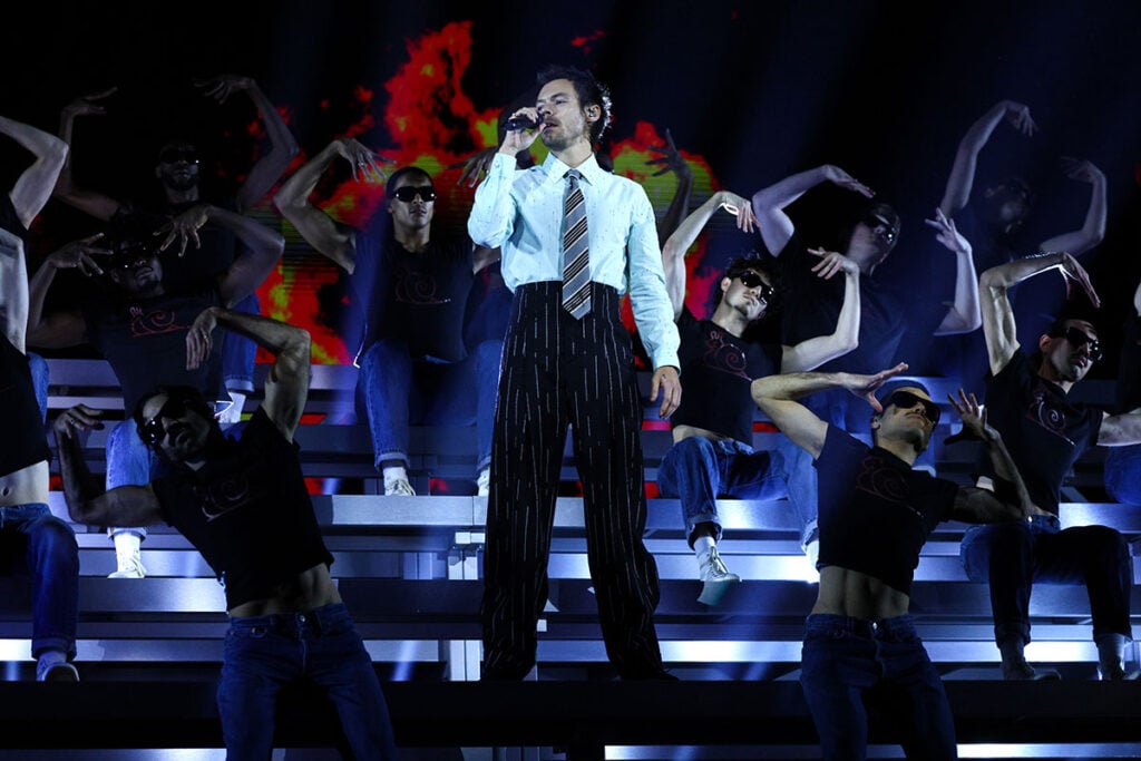 Harry Styles, BRIT Awards 2026, Harry Styles Chanel Pre-Fall 2026, Chanel Pre-Fall 2026 menswear, Harry Styles pinstripe suit, Harry Styles BRIT Awards red carpet, Chanel bouclé suit, Harry Styles performance look, BRIT Awards fashion 2026