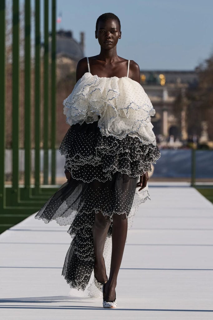 Dior Fall 2026 runway look featuring a layered black-and-white tulle skirt and ruffled bodice