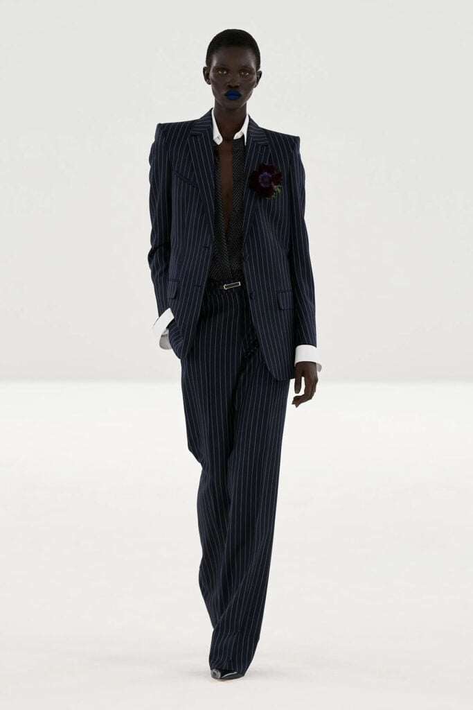 TOM FORD by Haider Ackermann Fall 2026 chalkstripe suit runway look with sheer shirt styling
