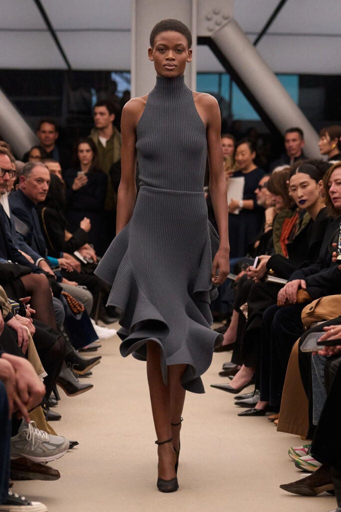 Alaïa Fall 2026 chartreuse ribbed knit top and asymmetrical ruffled skirt on the runway