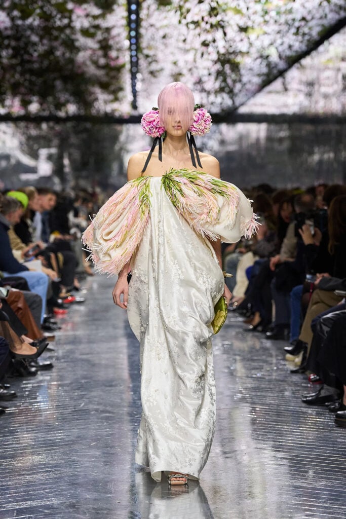 Dior Spring 2026 Haute Couture gown with draped neckline and organza fringe on the runway.