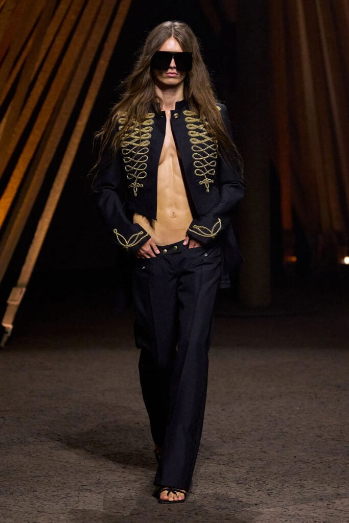 McQueen Spring 2026 slashed utility jacket and bumster trousers on the runway