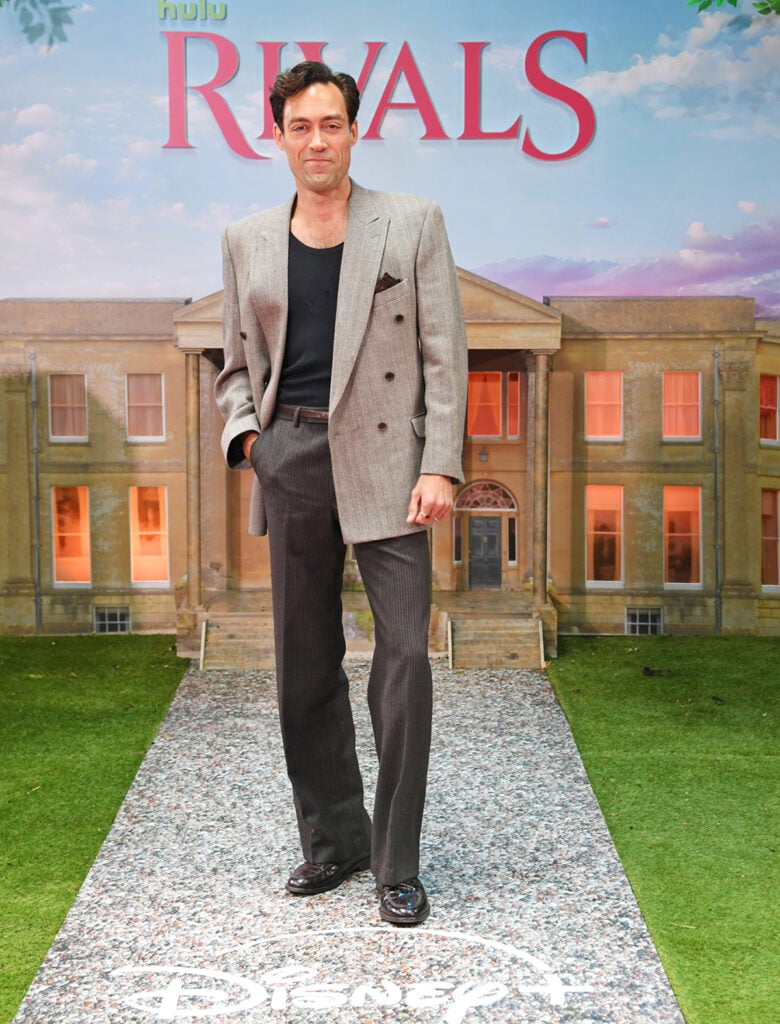 Alex Hassell attended the Rivals Season 2 premiere at BFI IMAX London in relaxed tailoring.