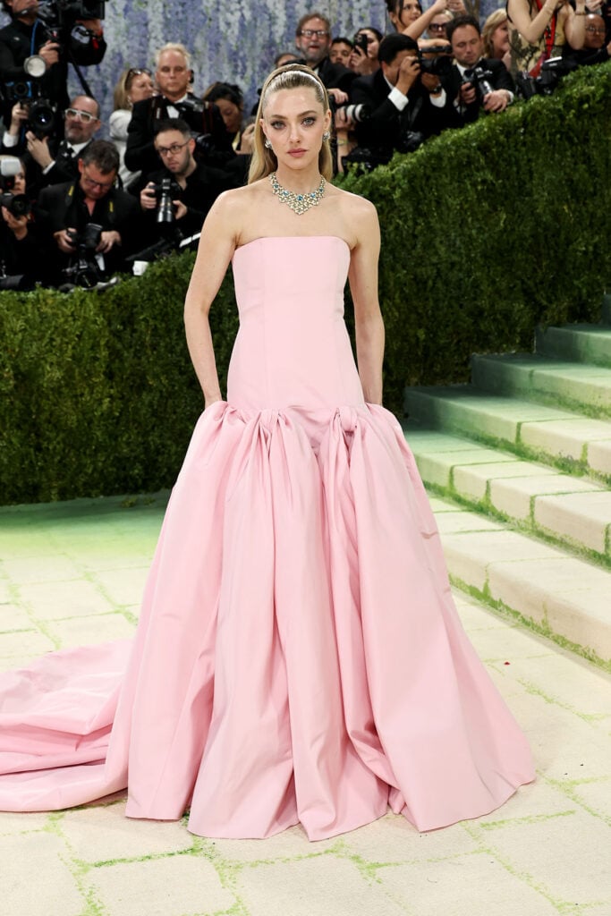 Amanda Seyfried in custom Prada alabaster-pink gown with bow skirt at the 2026 Met Gala