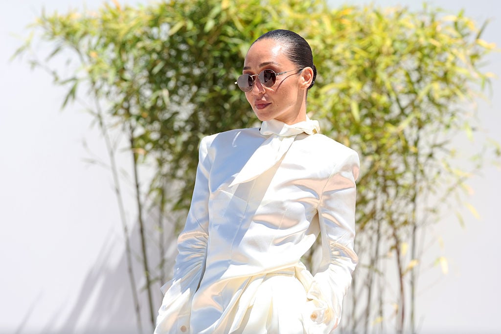 Close-up of Ruth Negga’s Celine lavallière tie and satin tailoring at the Cannes Film Festival photocall