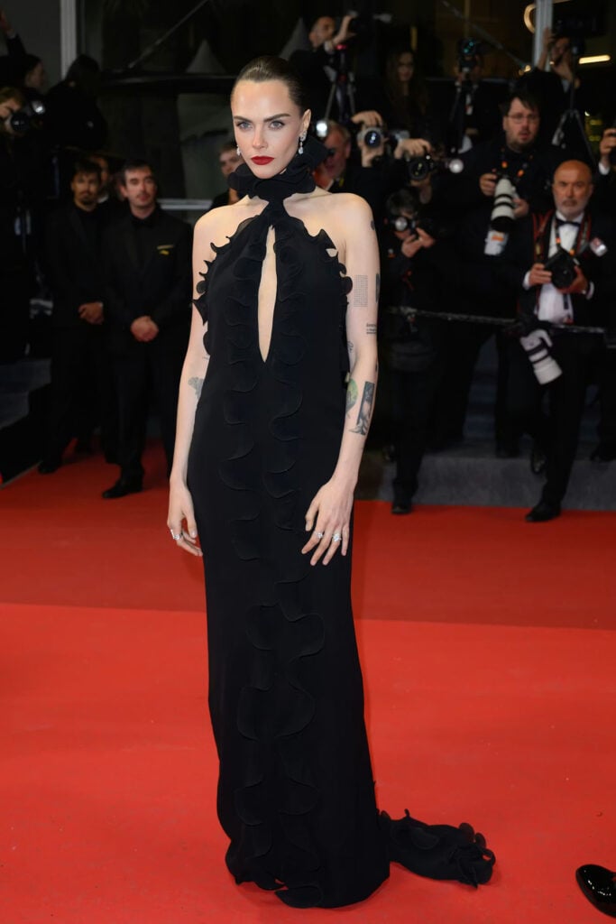 Cara Delevingne wearing Tom Ford at the Club Kid Cannes Film Festival premiere in a black cut-out gown