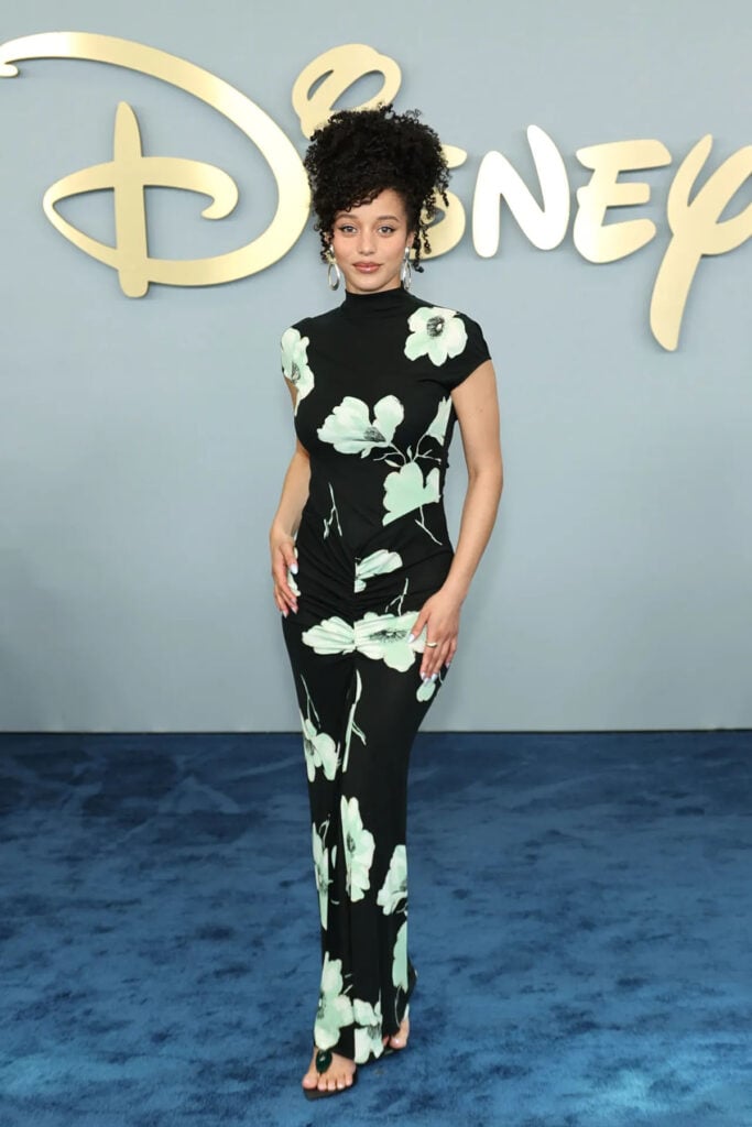 Chase Infiniti wearing a floral Alaïa fitted dress at the 2026 Disney Upfront
