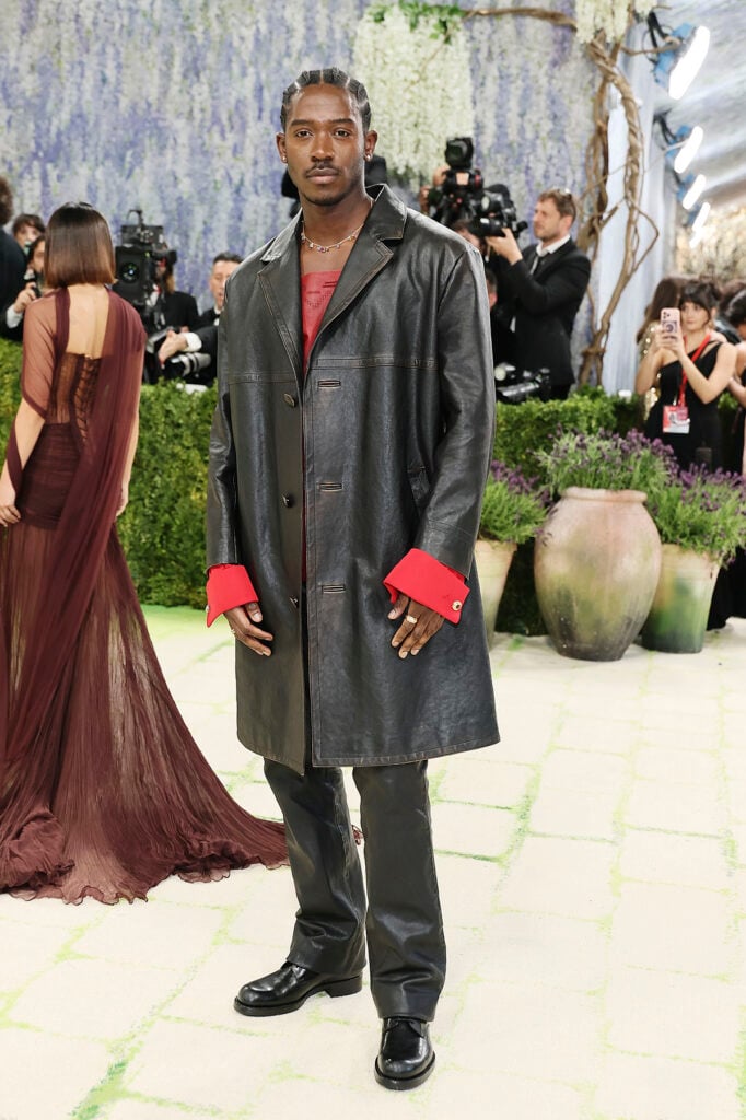 Damson Idris in custom Prada black look with DIDRIS Rainbow Maxi necklace at the 2026 Met Gala