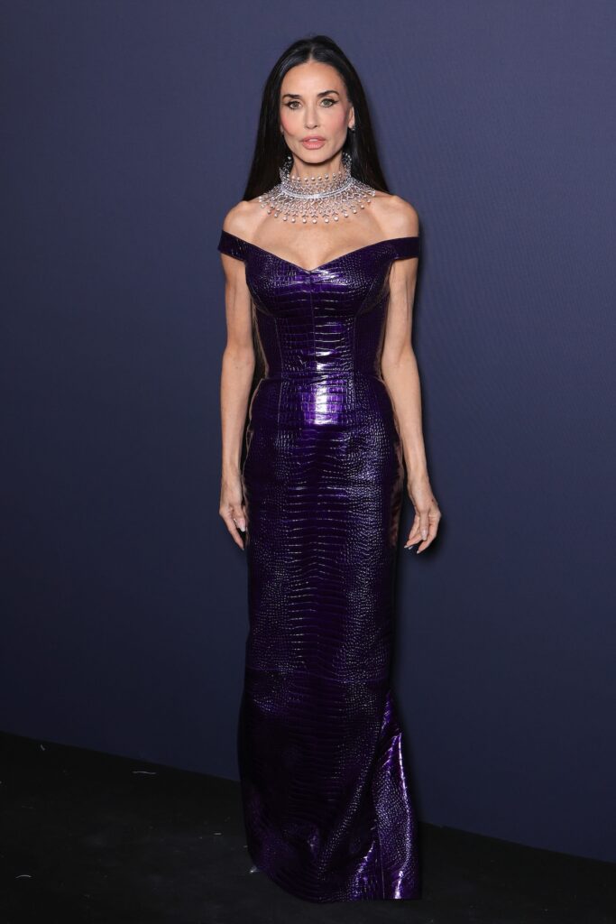Demi Moore wore a purple croc-embossed Gucci gown with Boucheron jewellery to the Kering Women In Motion dinner at Cannes.