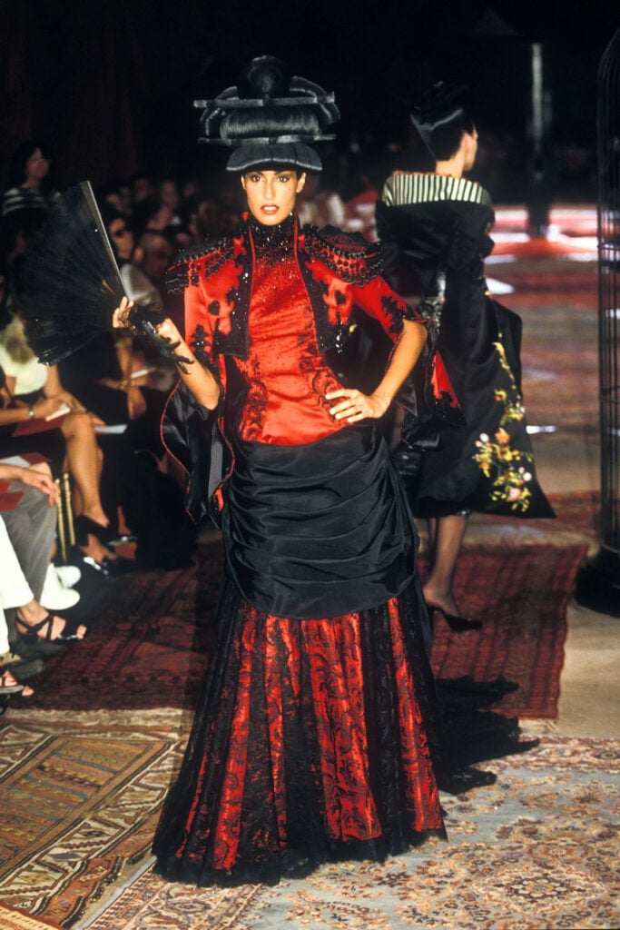 Givenchy Haute Couture Fall-Winter 1997 designed by Alexander McQueen runway look in red and black satin with lace detailing