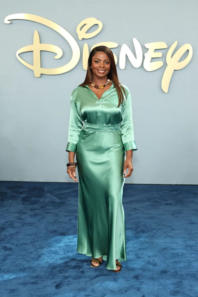 Janelle James wearing a green satin L’Agence look at the 2026 Disney Upfront
