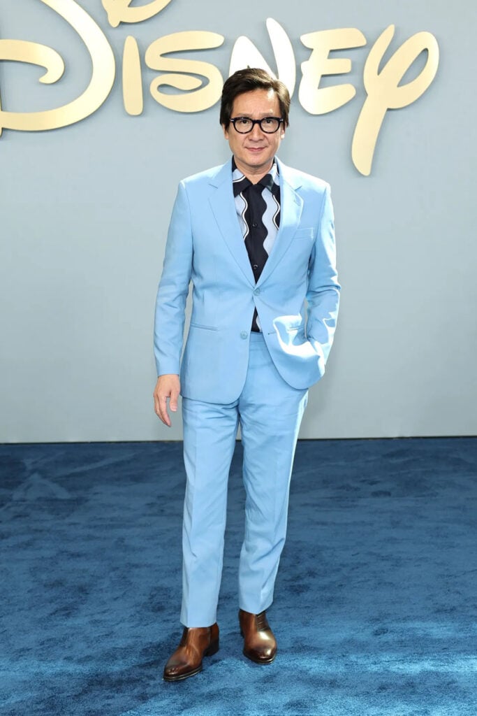 Ke Huy Quan wearing a powder-blue suit at the Disney Upfront in New York
