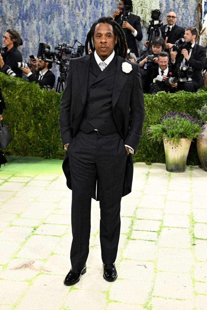 Jay-Z in Louis Vuitton tailcoat tuxedo with white flower brooch at the 2026 Met Gala