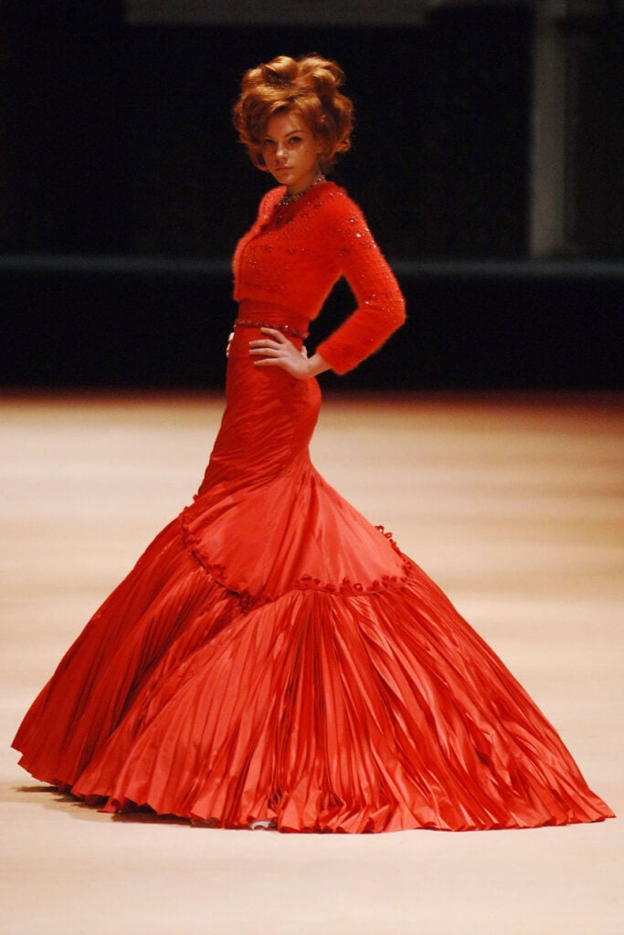 Alexander McQueen Fall 2005 red strapless taffeta gown with pleated mermaid skirt on the runway.