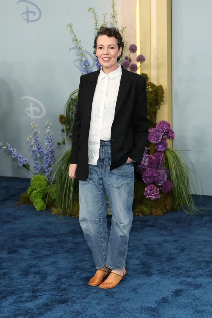 Olivia Colman wearing jeans, a blazer and sheer shoes at the 2026 Disney Upfront
