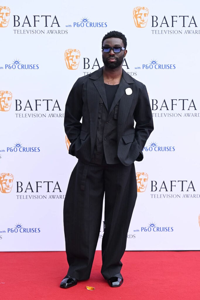 Paapa Essiedu wearing layered black tailoring at the BAFTA TV Awards in London
