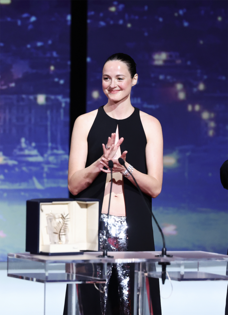 Side view of Renate Reinsve wearing custom Louis Vuitton with metallic pumps at the Cannes Film Festival closing ceremony.