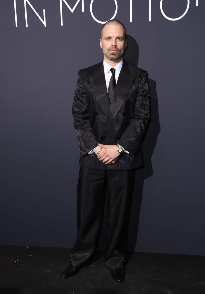 Sebastian Stan wore a black iridescent pinstripe Gucci suit to Kering’s Women In Motion dinner at Cannes Film Festival.