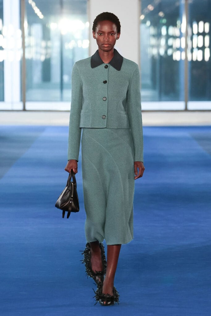 Proenza Schouler Fall 2026 blue wool jacket and skirt ensemble presented on the runway.