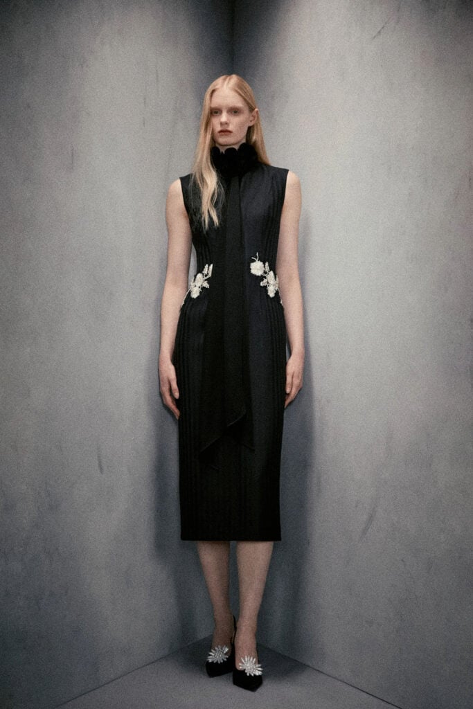 Huishan Zhang Resort 2027 black dress with floral embroidery from the runway collection