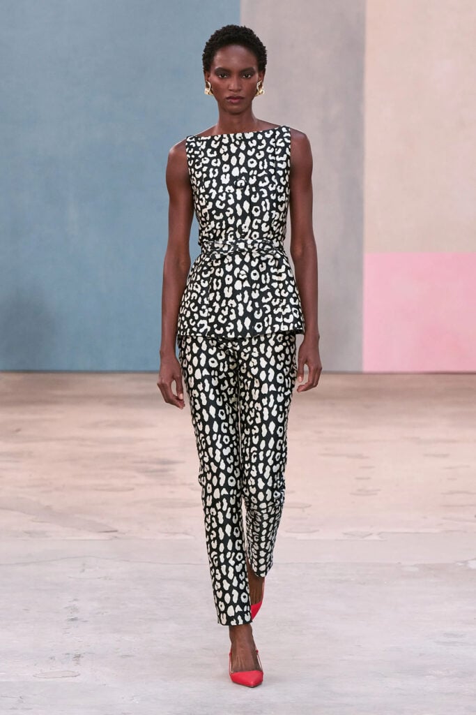 Carolina Herrera Fall 2026 leopard-print peplum top and tailored trousers on the runway.