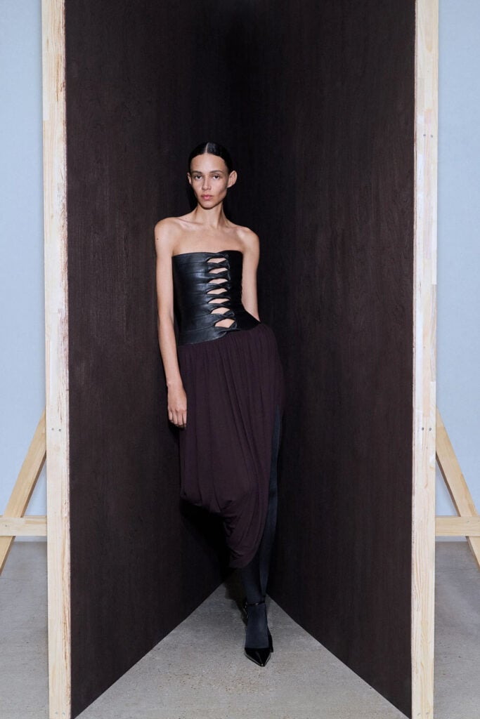 Alaïa Archetypes draped jersey dress with paneled leather bustier runway reference
