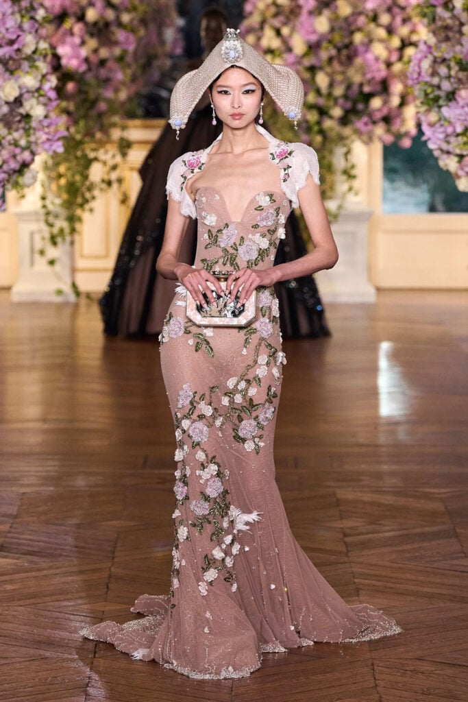 Miss Sohee couture runway look featuring blush embroidery, dove detailing and a sculpted corseted silhouette