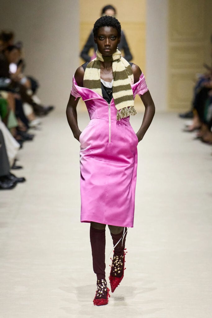 Prada Fall 2026 pink satin zip-front dress presented on the runway during Milan Fashion Week.
