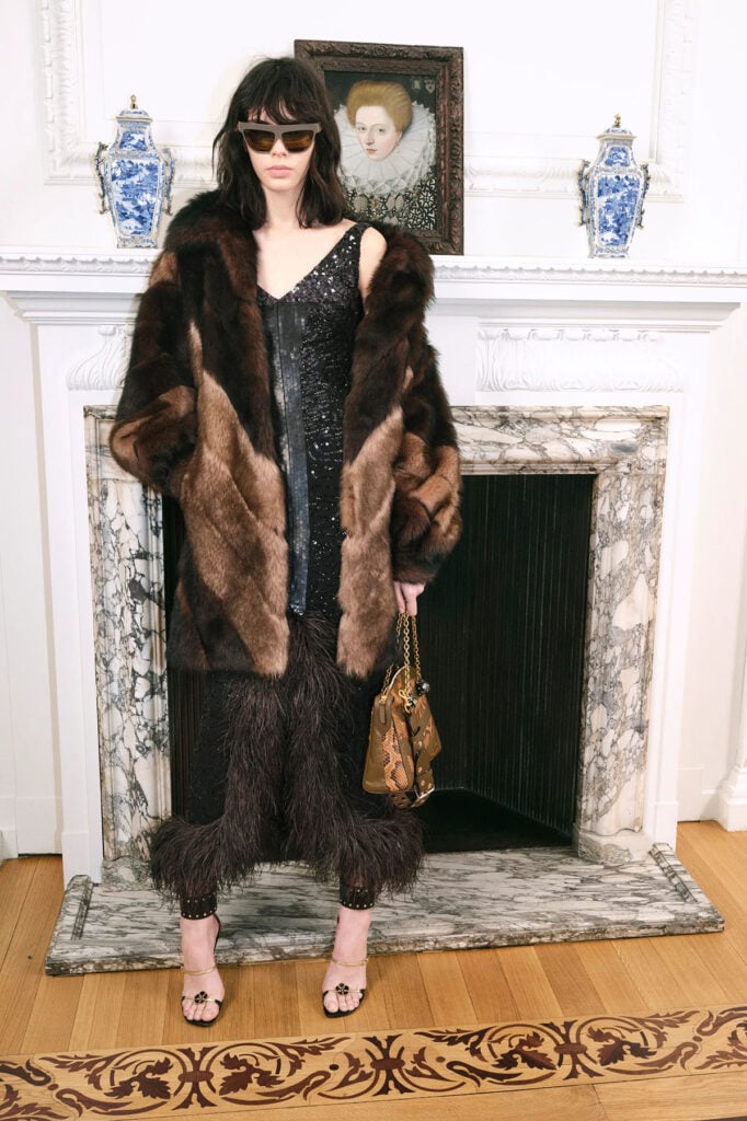 Valentino Pre-Fall 2026 faux-fur coat and feather-trimmed dress from the runway presentation