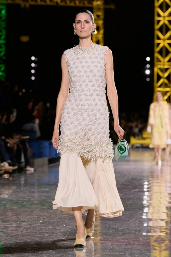 Chanel Fall 2026 dress with textured floral detailing and pleated hem on the runway.
