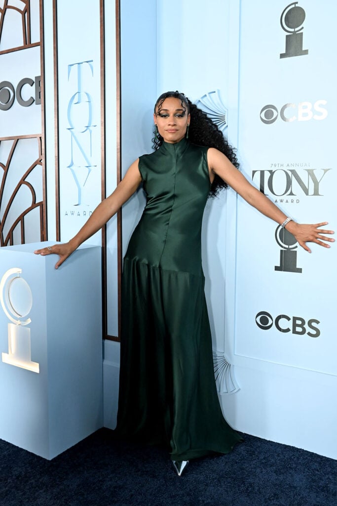 Ariana DeBose poses on the Tony Awards red carpet wearing a sleeveless Fforme design with a drop-waist silhouette.