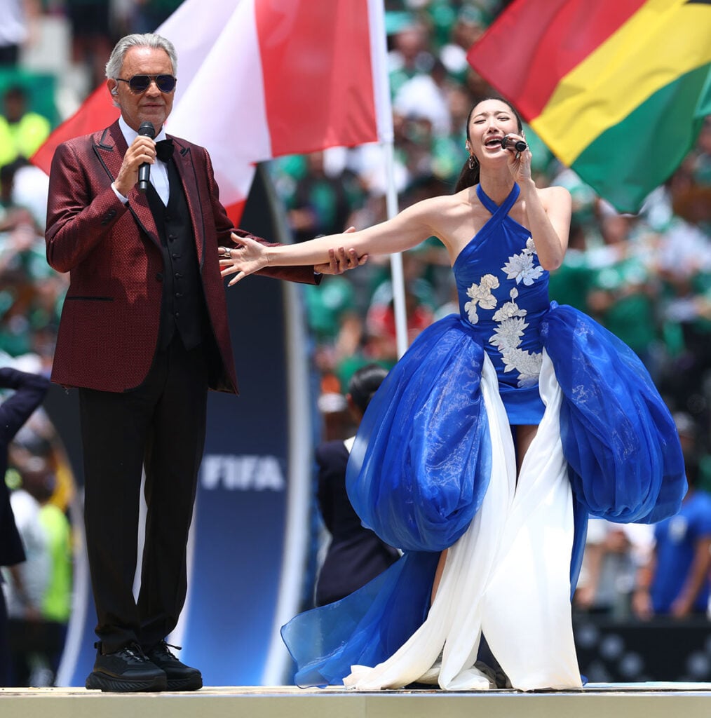 Andrea Bocelli and  Ejae perform prior to the FIFA World Cup 2026 

Ejae wearing a custom LEJE gown while performing "DNA" with Andrea Bocelli at the FIFA World Cup 2026 opening ceremony