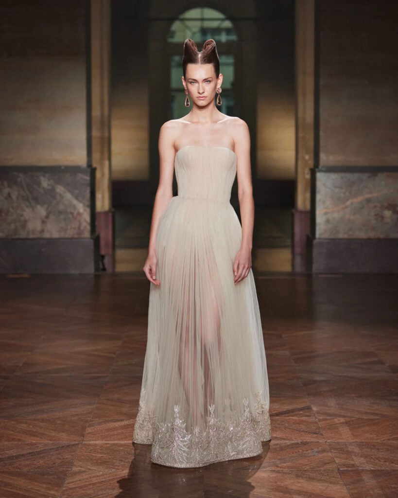 Georges Hobeika Fall 2026 Couture champagne micro-pleated strapless ballgown on the runway.