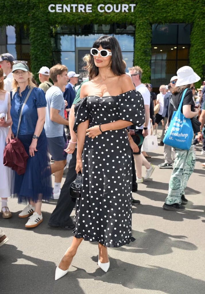 Jameela Jamil attends Wimbledon 2026 in a Queens of Archive polka-dot dress.