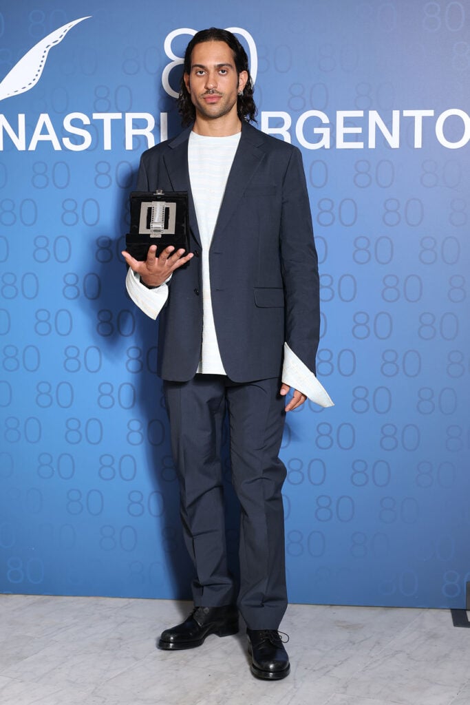 Mahmood poses with the Nastro D'Argento award during the 80th Nastri D'Argento 2026 - Cinema photocall 