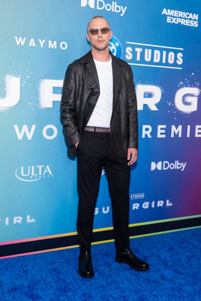 Nicholas Hoult wearing Prada at the Supergirl New York premiere in New York City.
