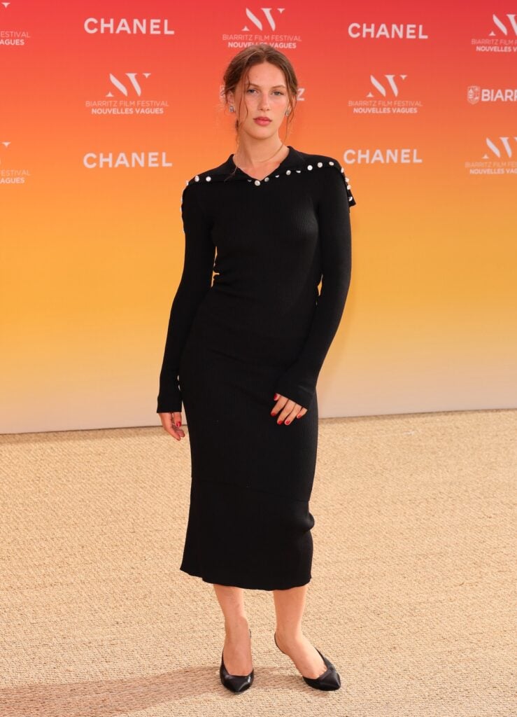Lou Lampros wears Chanel Pre-Fall 2026 at the Nouvelles Vagues International Biarritz Film Festival.