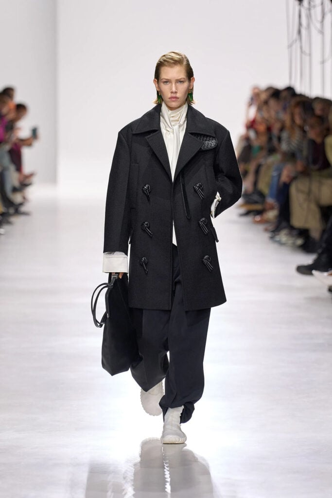 Bottega Veneta Spring 2026 white scarf-neck blouse on the Milan Fashion Week runway.