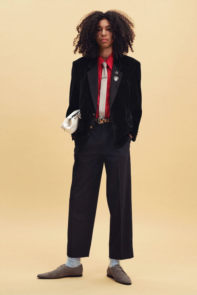 Coach Resort 2027 runway look featuring the red shirt, silver tie and navy trousers later worn by Zendaya.