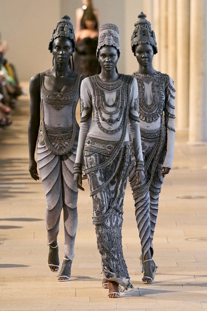 A runway look from the Rahul Mishra Fall 2026 Couture collection inspired by India's ancient temple carvings in Paris.