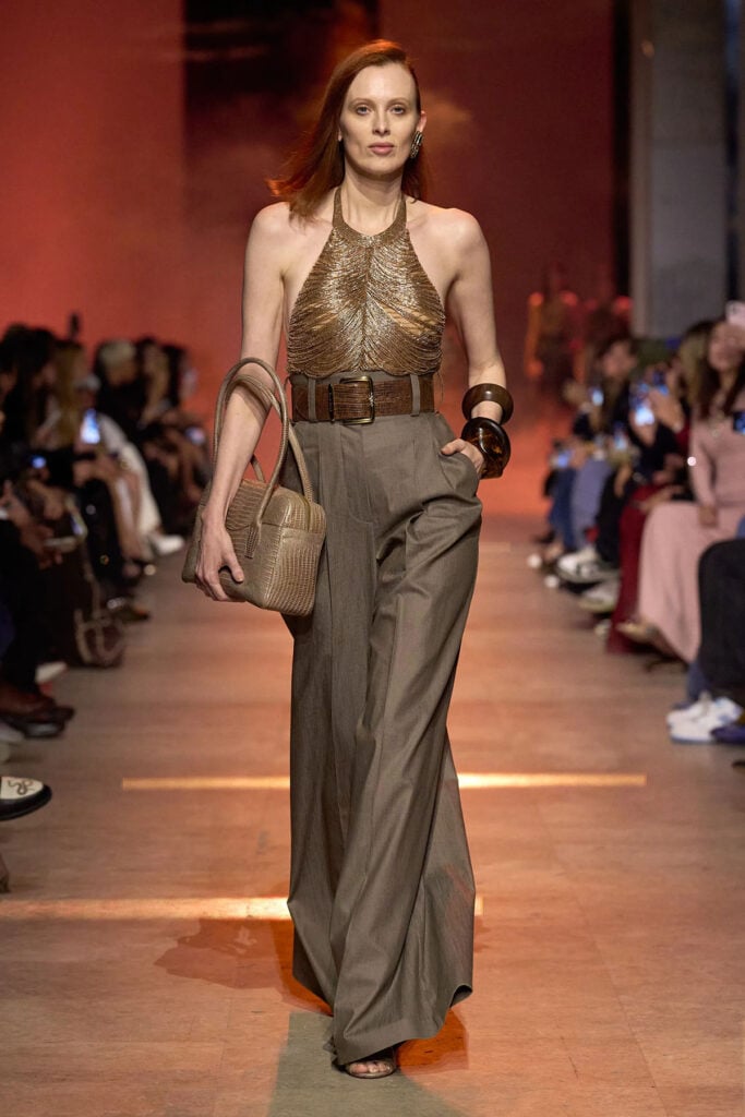 Elie Saab Spring 2026 runway look featuring a chain-fringed halter top and wide-leg trousers.