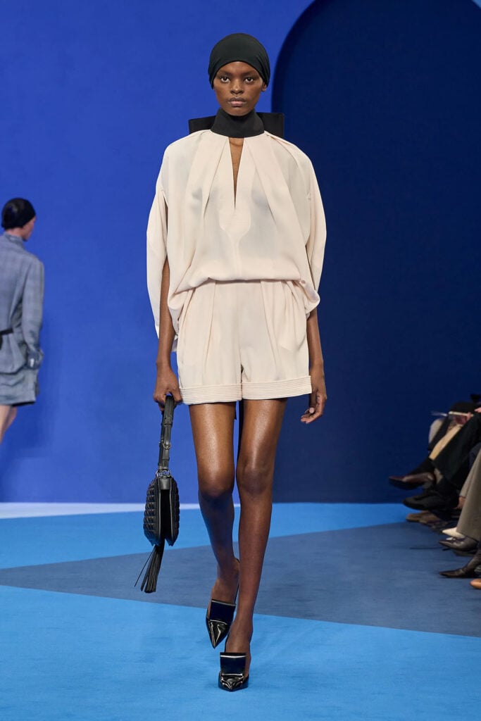 Model walks the Lanvin Spring 2026 runway wearing the halterneck blouse and tailored shorts later worn by Charlize Theron.