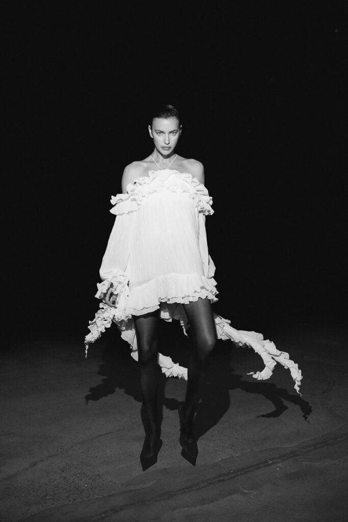 Blumarine Resort 2027 white high-low ruffled dress shown on the runway.