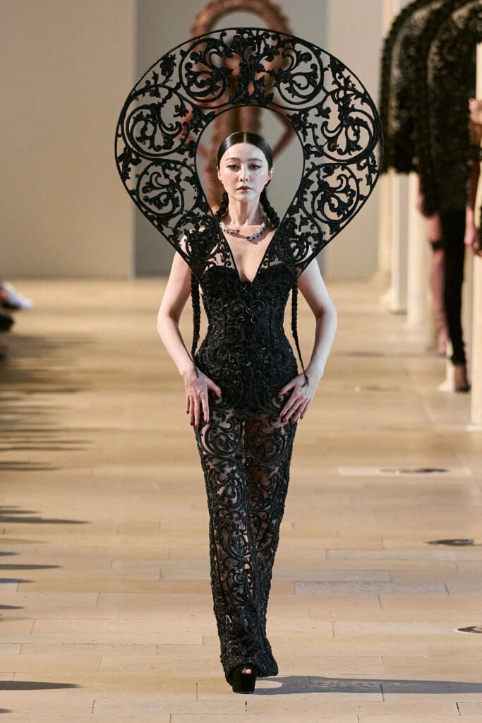 Fan Bingbing walking the Rahul Mishra Fall 2026 Couture runway in an embroidered black sculptural gown with oversized lace halo.