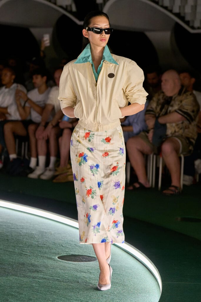 Willy Chavarria Spring 2027 runway look featuring the blue shirt layered beneath the tailored ensemble.