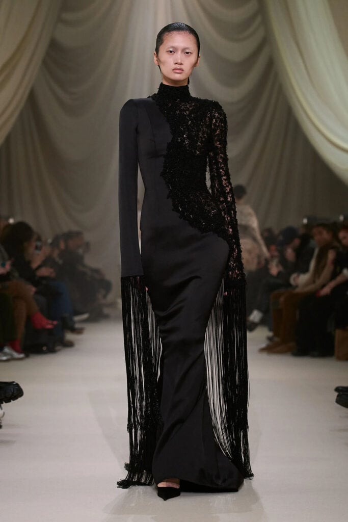 Ashi Studio Spring 2026 Couture black gown with web-like embroidery and beaded fringe on the runway.